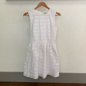 Young ladies White Gap size 2 thigh high sundress, front pockets and lined.